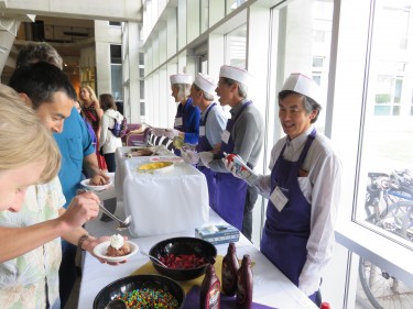 Members of the College's Executive Committee serve up ice cream sundaes at the College's Spring Celebration