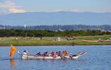 The Salmon Dancer Canoe Family paddles along the shorelines of Swinomish